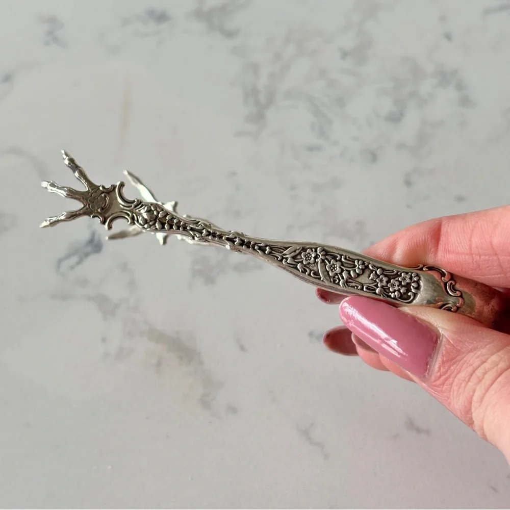 Antique sterling sugar tongs made by Whiting Manufacturing Co